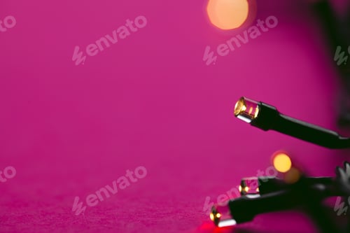 Preview: Illuminated garland lights on bright pink background