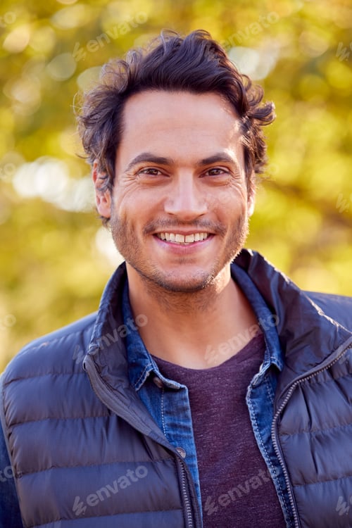 Preview: Portrait Of Smiling Man Outdoors Relaxing In Autumn Park