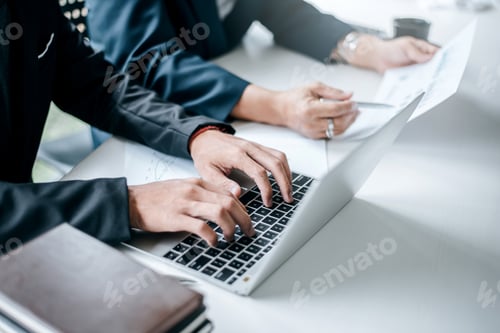 Preview: Image Businessman working on computer laptop during a meeting.