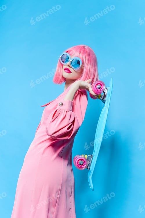 Preview: fashionable woman in sunglasses wears a pink wig studio model unaltered