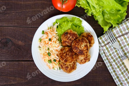Preview: Juicy cutlets and salad with fresh vegetables