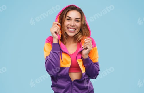 Preview: Excited female in bright hoodie