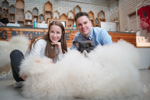 Preview: Man and girl with his pet dog playing on the floor. Happy dog, happy guy with dog.