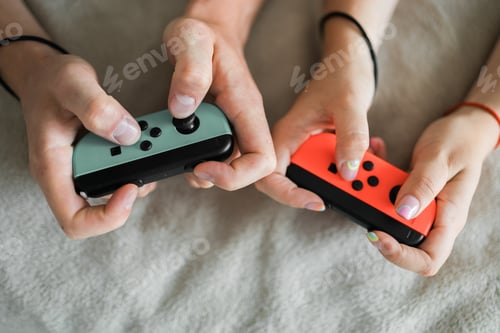 Preview: Hands using game controller. Playing video games