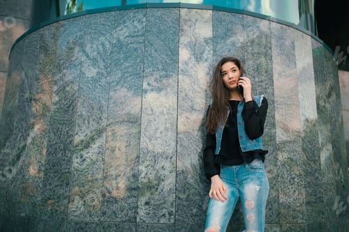 Preview: Beautiful teens talk to smartphone, and have fun in the city