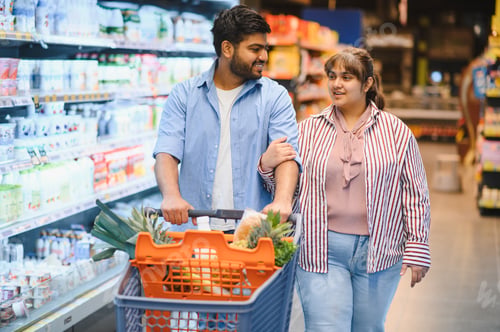 Preview: Indian couple shopping for groceries in supermarket