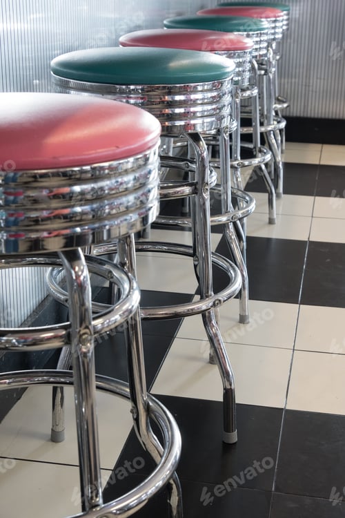 Preview: Vertical shot of colored stools at a classic American 1950s style diner in Tennessee