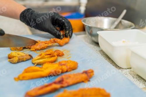Preview: Chef preparing fresh fish roe in a professional kitchen