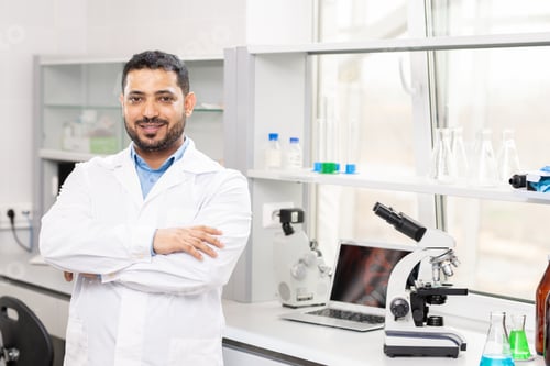 Preview: Content young Arabian scientist in laboratory