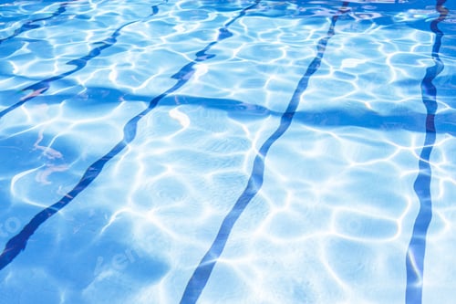 Preview: Ripple Water in swimming pool with sun reflection. Summer day at swimming pool.