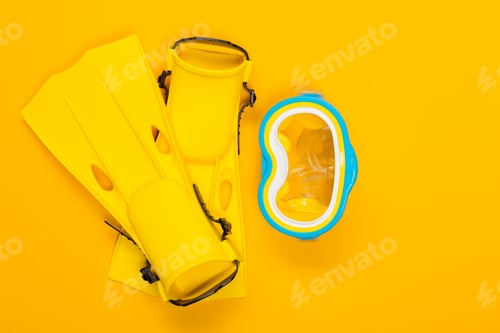 Preview: Bright yellow snorkeling gear on a vibrant background ready for underwater adventure