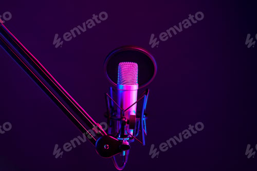 Preview: Professional microphone against black background in studio