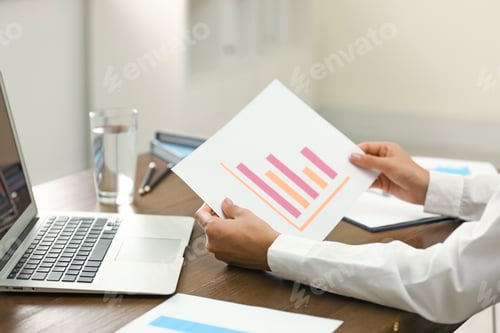 Preview: Business trainer working at table in office, closeup