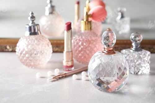 Vista previa: Different perfume bottles on dressing table, space for text