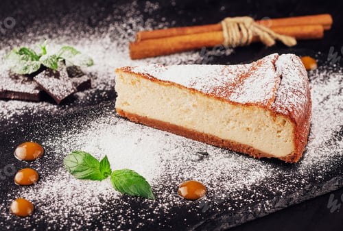 Preview: Delicious cheesecake with vanilla on black board