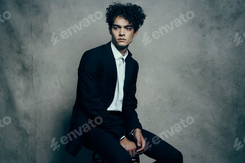 Preview: man in black blazer curly hair fashion modern style official