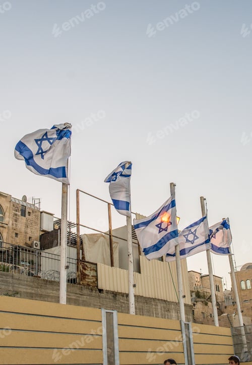 Preview: Flags Blowing Gently in Jerusalem Against Building