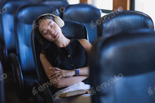 Preview: Woman sleeping with headphones on a bus