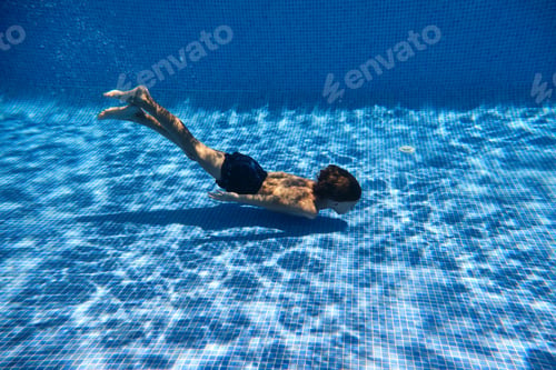 Preview: Child swimming in blue pool