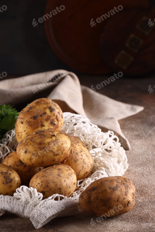 Preview: organic food raw potatoes on the table