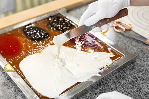Preview: The chef adds the dye to the hot caramel, lollipops, and mixes. Candy. Handmade.