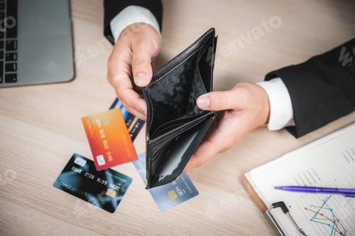 Preview: High angle closeup view of hands of a businessman in formal clothing looking