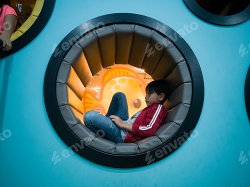 Preview: young boy sitting in a circle pod
