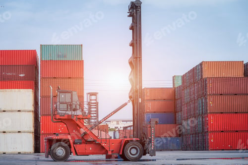 Preview: Crane lifting up container in yard.