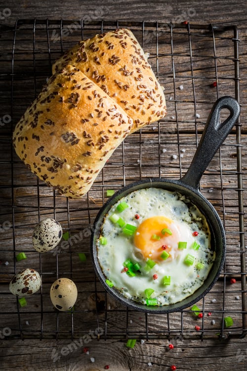 Preview: Fried eggs with chive and roll for breakfast