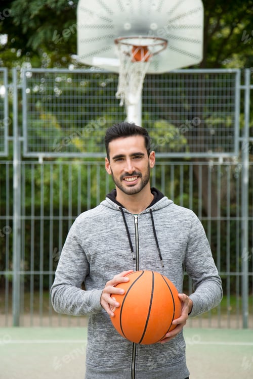 Preview: Happy man in a basketball court