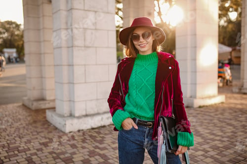 Preview: attractive woman in autumn style trendy outfit walking in street