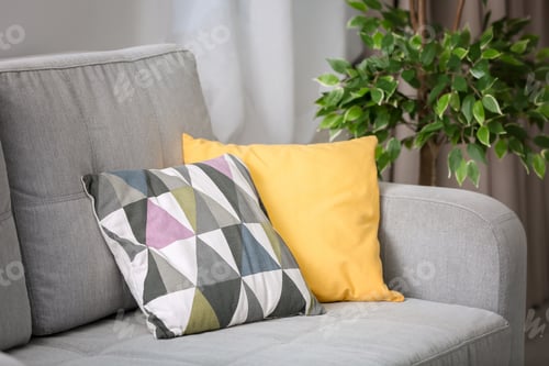 Preview: Comfortable sofa with pillows in living room