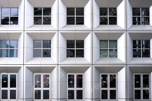 Preview: Perfect symmetrical facade with large windows of a modern aluminum building.