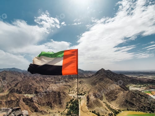 Preview: United Arab Emirates flag on the r were in’s on top of the mountain