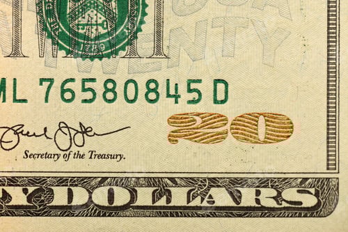 Preview: Macro shot with part of 20 US dollars bill. Twenty dollars banknote close up photo