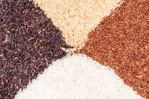 Preview: Thai rice varieties of brown rice mixed on table. Rice background.