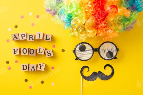 Preview: Snapshot of wooden letters spelling "April Fool's Day," confetti