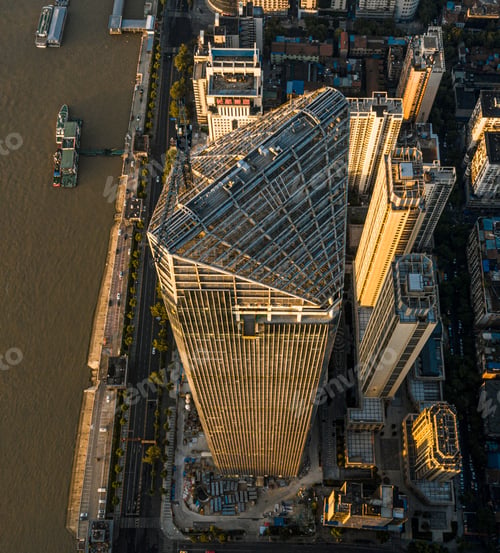 Preview: View of A skyscraper decorated with glass curtain walls by the Yangtze River