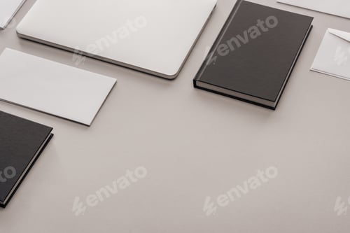 Preview: black and white stationery and laptop on grey background