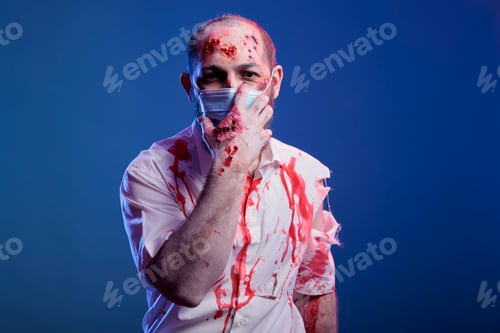 Preview: Portrait of actor portraying zombie in movie with face mask after virus outbreak