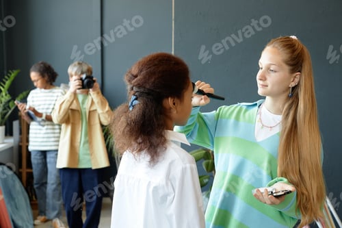 Preview: Young Makeup Artist Working with Model