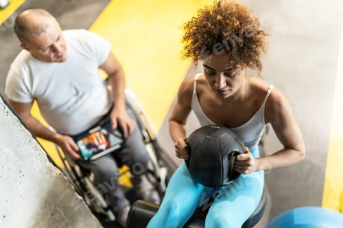 Preview: A determined fitness instructor in a wheelchair