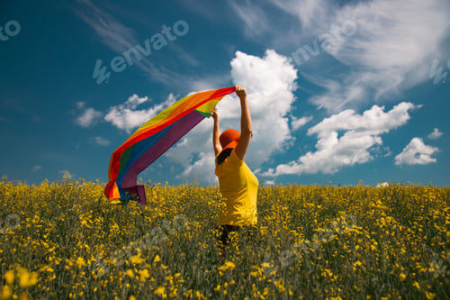 Preview: Young woman with LGBT flag.