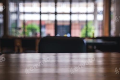 Preview: Wooden table top with blurred background in cafe