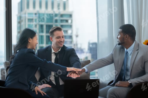 Preview: Businesspeople can motivate each other by joining hands.