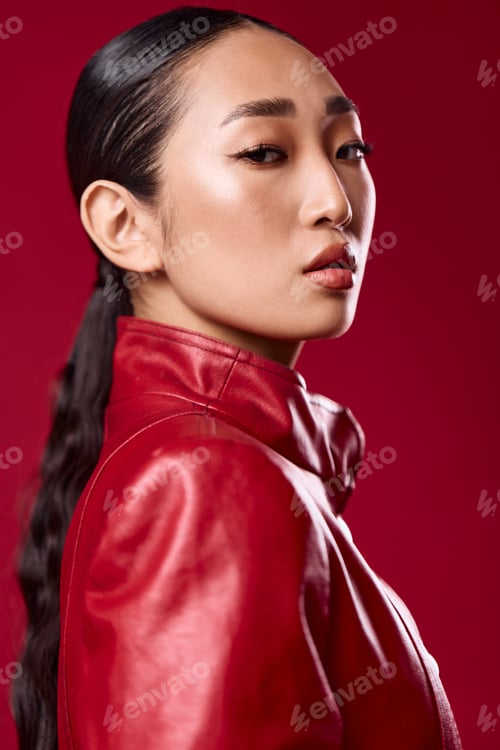 Preview: Woman in Red Jacket on Red Background