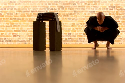 Preview: young woman in a black suit and a white shirt on a wooden wall