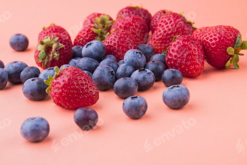 Preview: Pile of many fresh ripe fruits isolated on orange background.