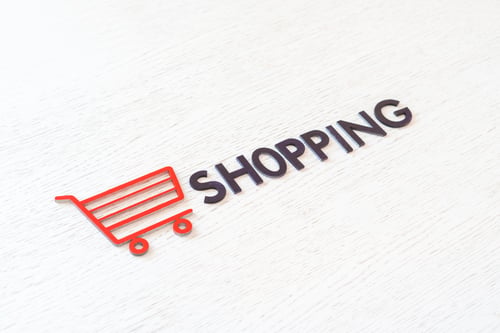 Preview: a shopping cart icon concept cut out letters, sale store business, simple minimalistic