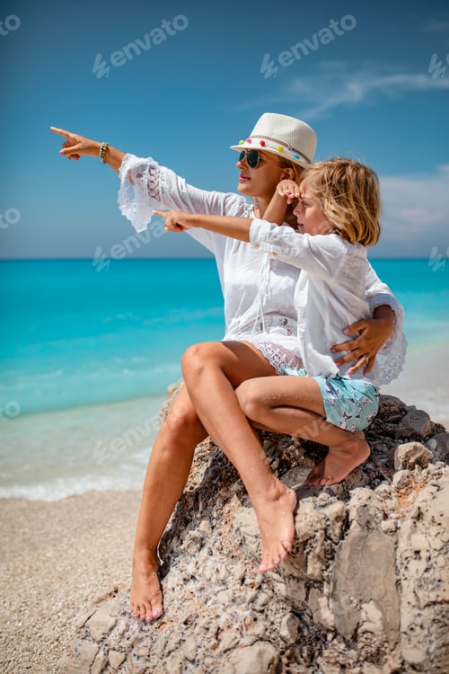 Preview: Woman with Child Enjoying Beach View Together